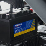 Chevrolet service technician installing a new battery