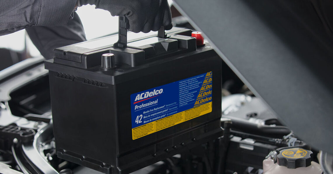 Chevrolet service technician installing a new battery